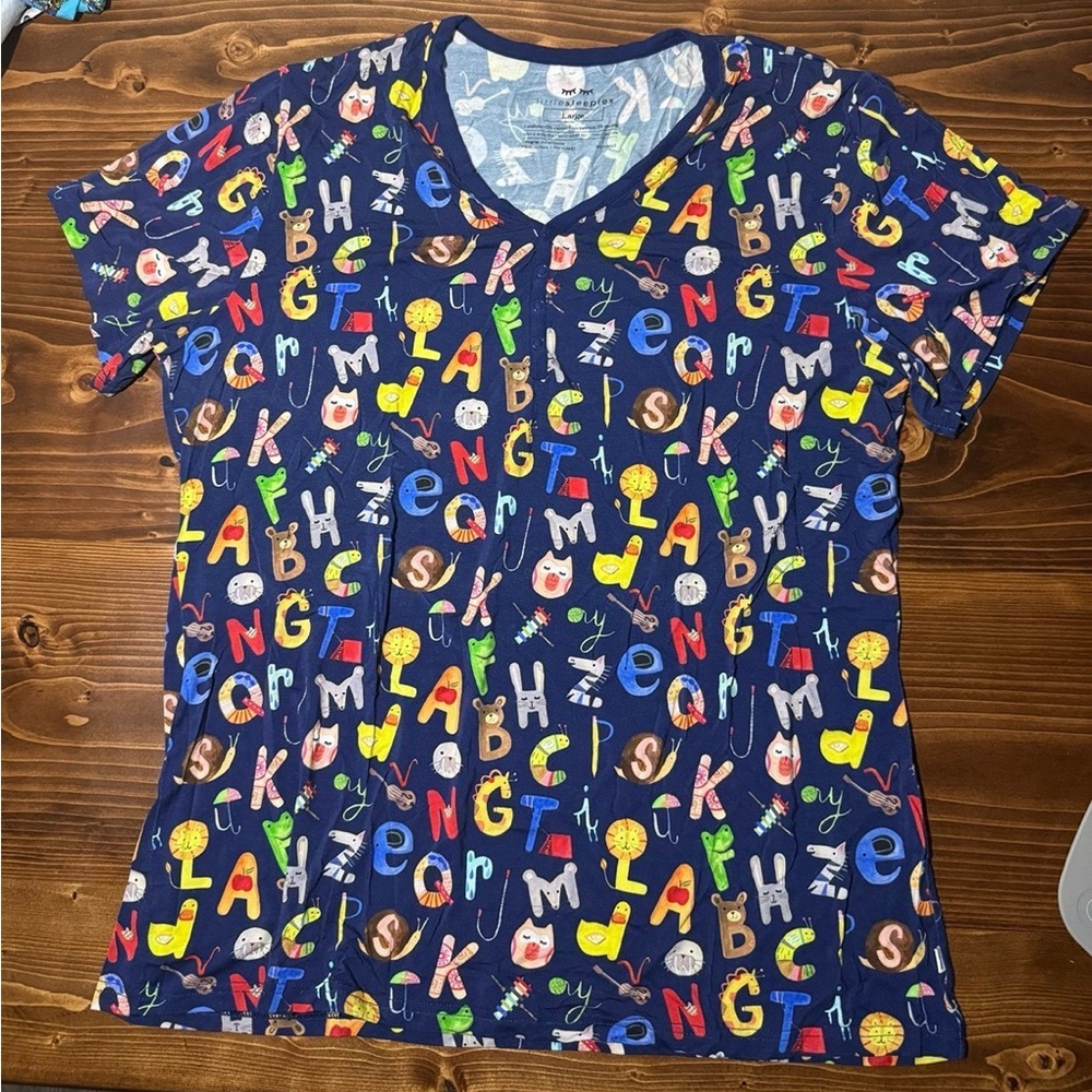Little sleepies alphabet top, size large